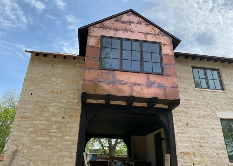 Copper metal panel facade on a stone building for Skylight Installation in West Covina